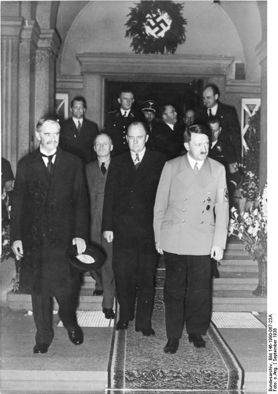 Joachim von Ribbentrop, Adolf Hitler, and Neville Chamberlain in Bad Godesberg
